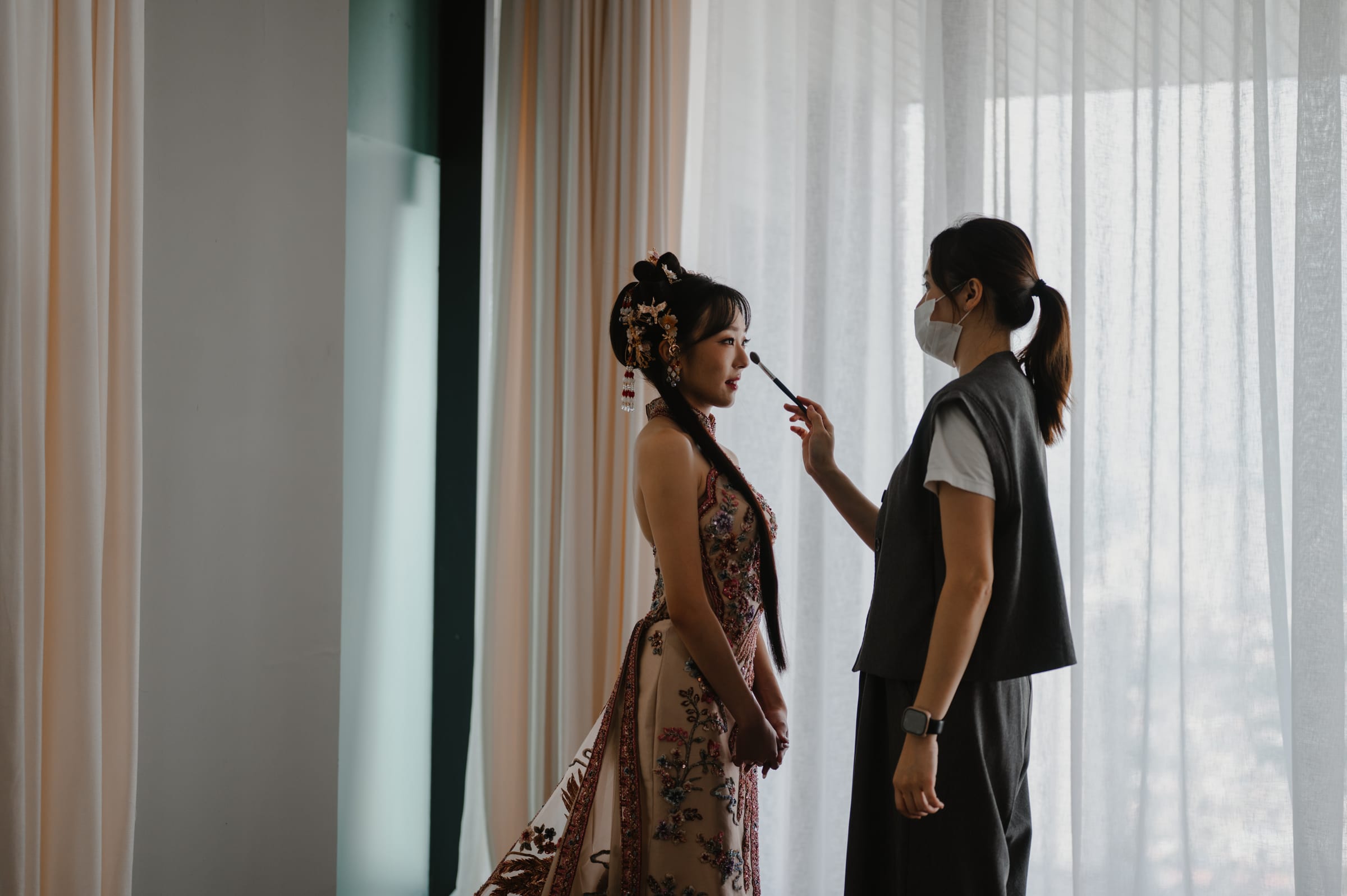 Bride getting ready in the bridal suite at W. in the Sky KL